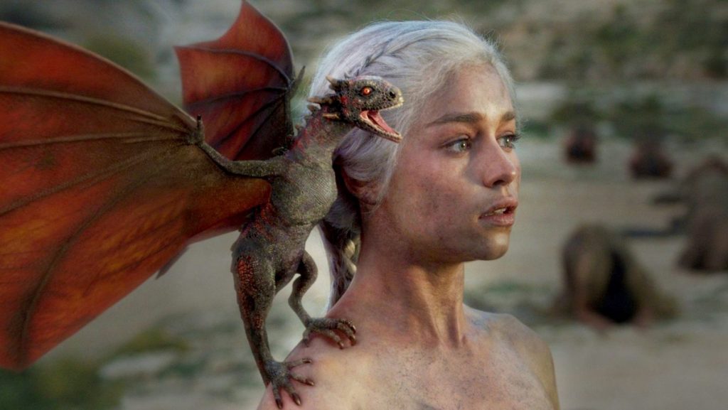 A baby dragon on Daenerys's shoulder on Game of Thrones