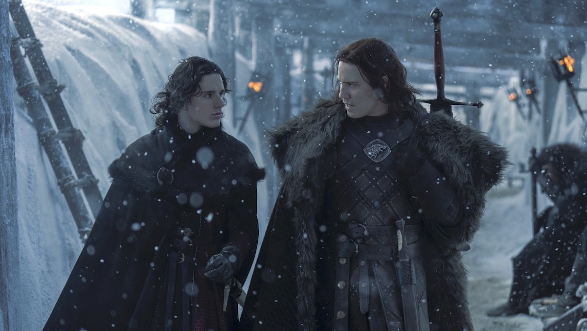 Jace and Lord Cregan talk as they walk among the falling snow atop the Wall on House of the Dragon