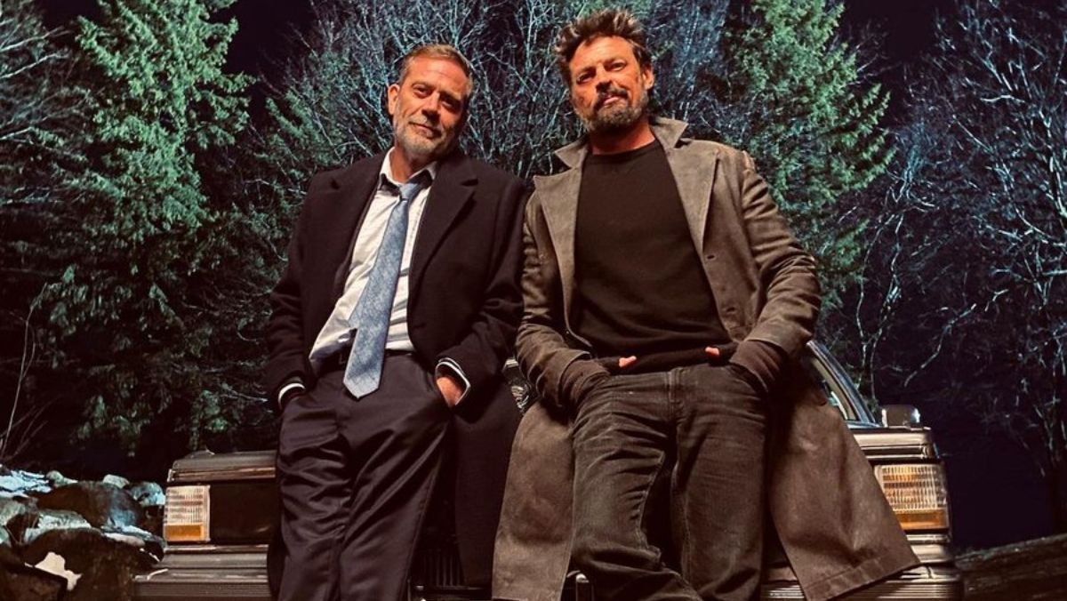 Jeffrey Dean Morgan and Karl Urban are in character and leaning on a car in The Boys season four photo