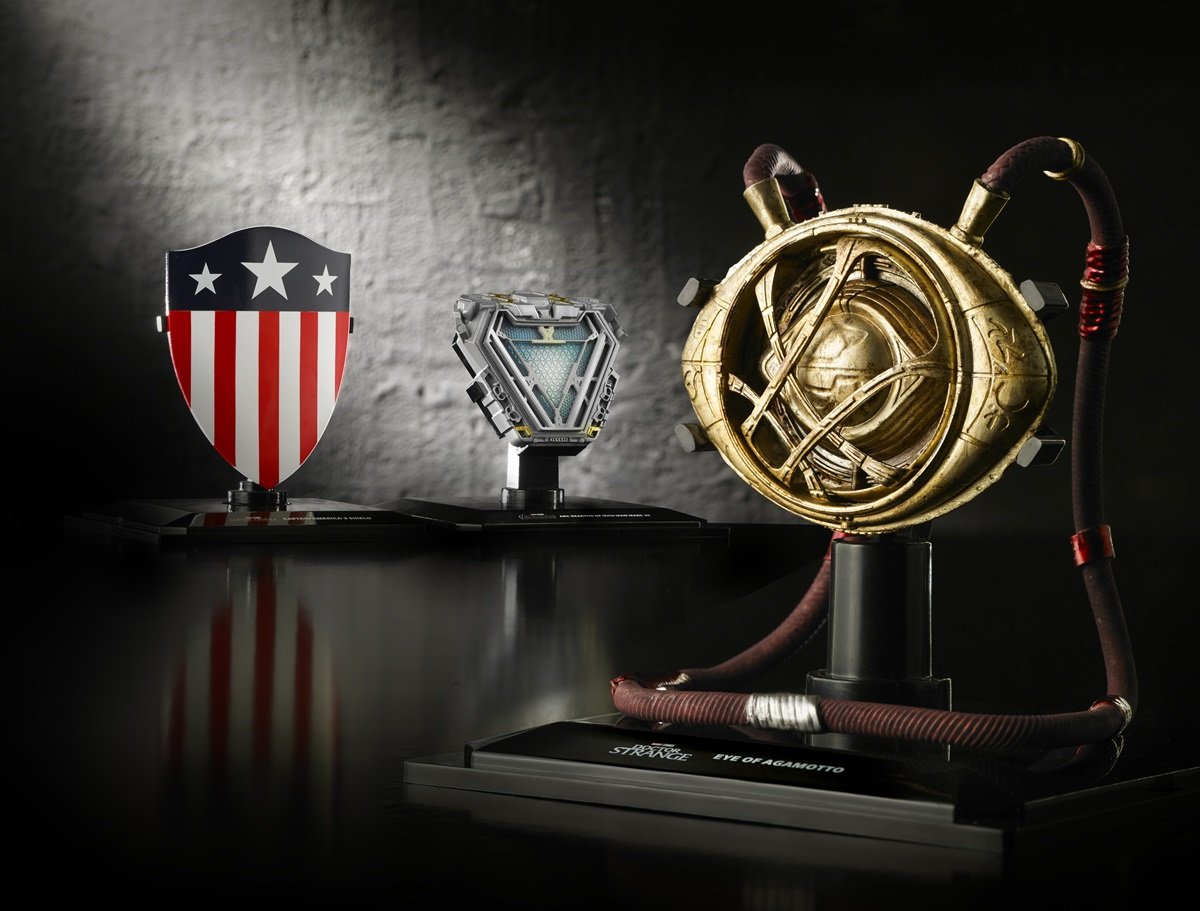 Marvel Movie Repliocas of Cap's first shield, the Iron Man ARC Reactor, and the Eye of Agamotto.