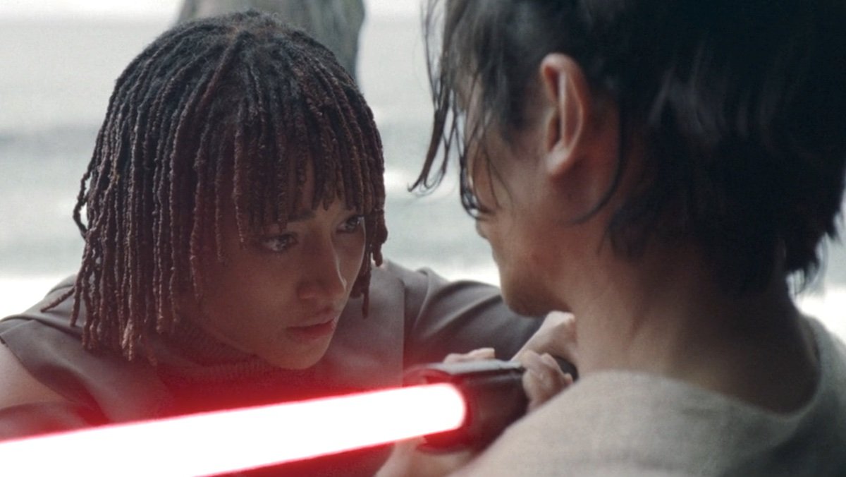 Osha holds a red lightsaber to Qimir's neck on The Acolyte