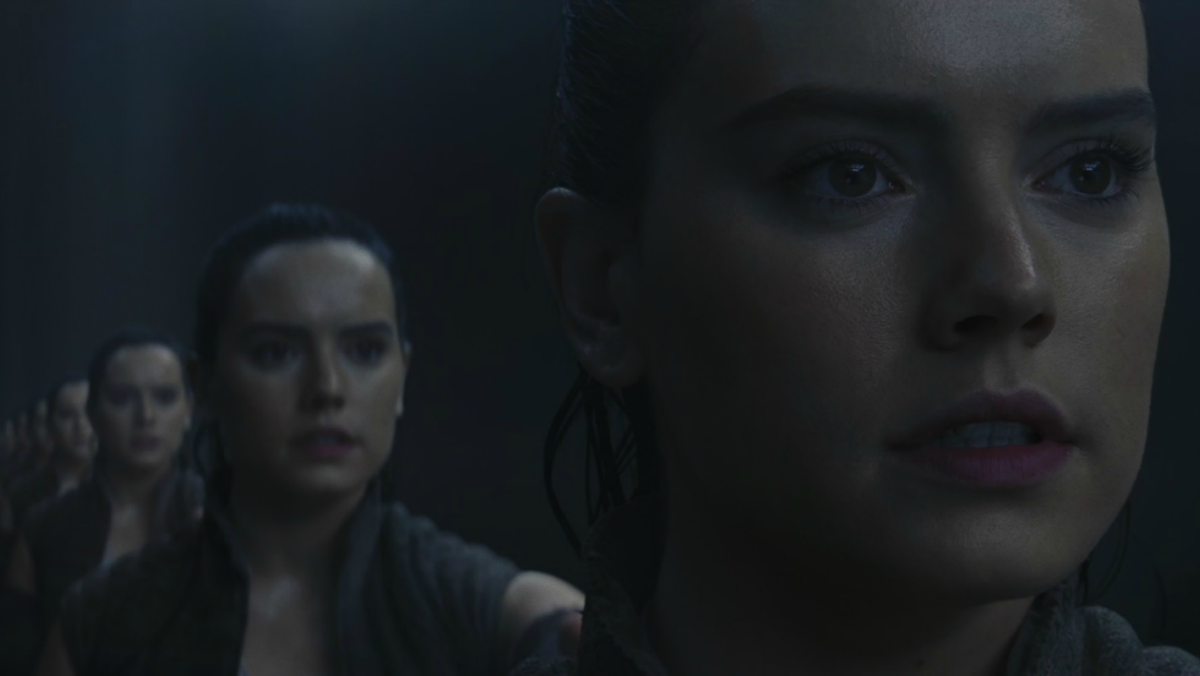 Rey views herself in the Ahch-To mirror cave in Star Wars: The Last Jedi.